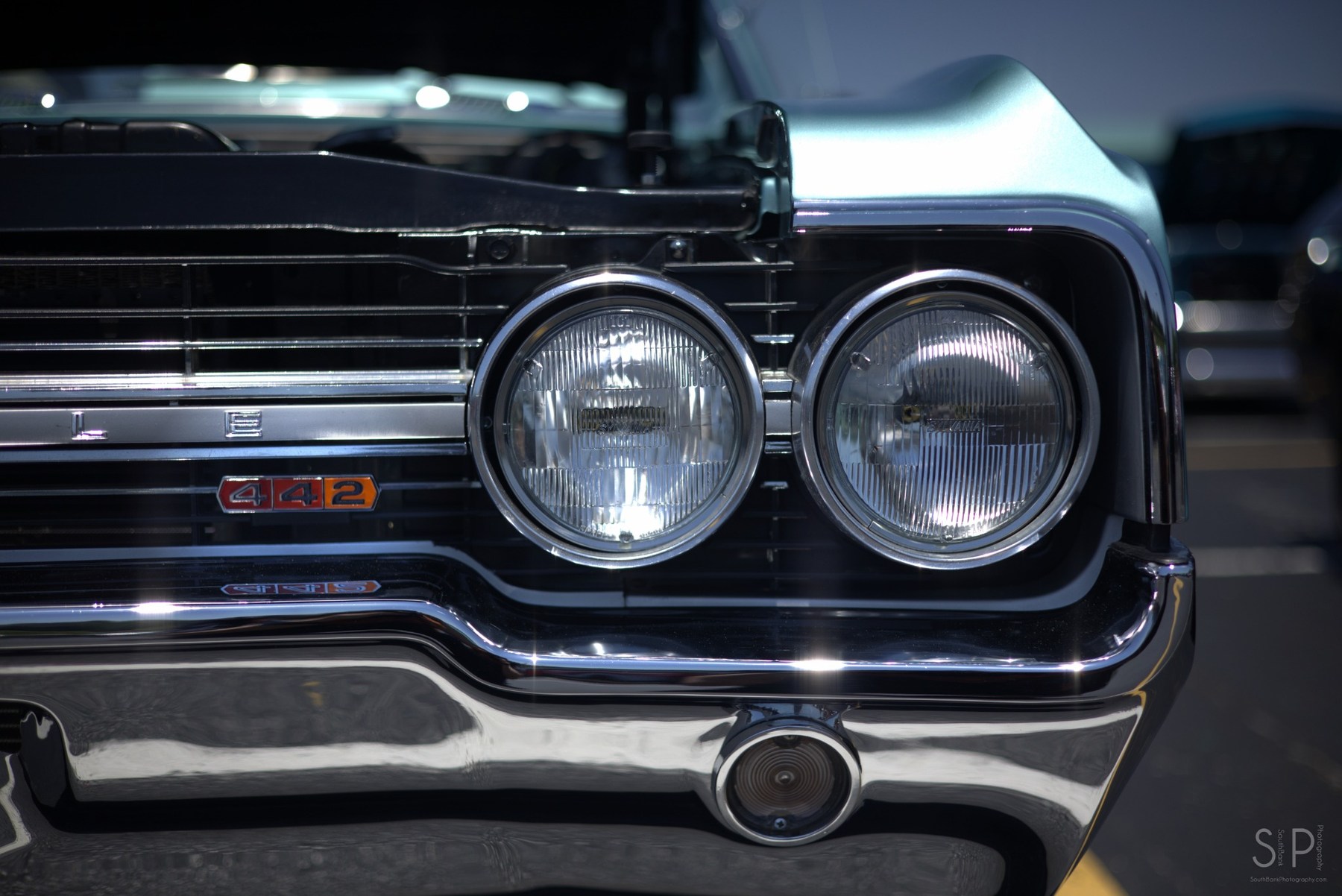 Close-up detail of the chrome front of a classic Oldsmobile 442