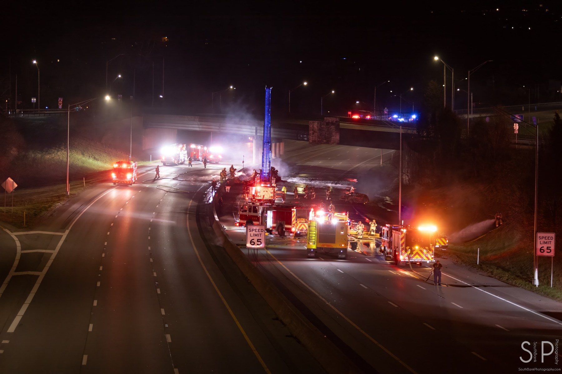 Emergency crews responding to an incident on a Cincinnati highway at night