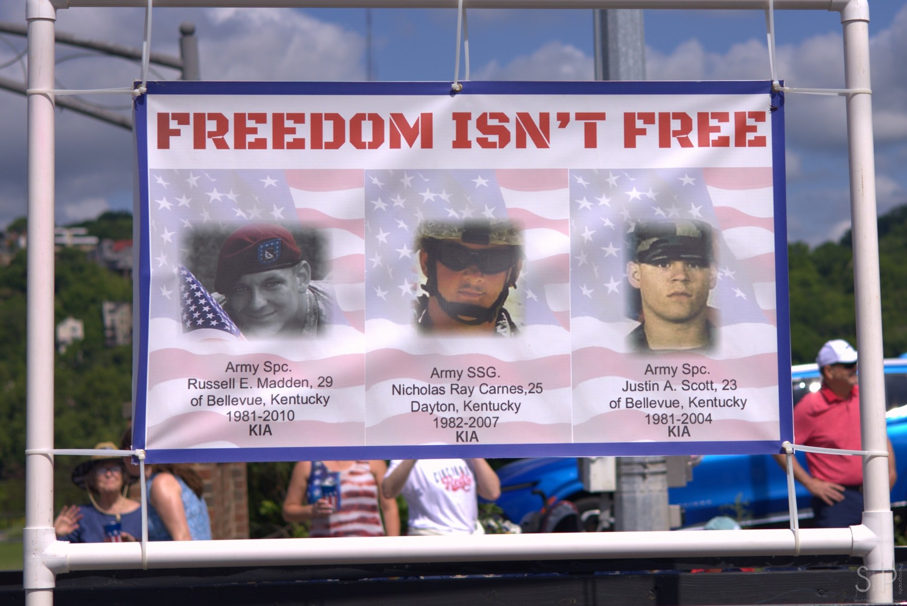 Memorial banner honoring fallen service members at a Bellevue community event
