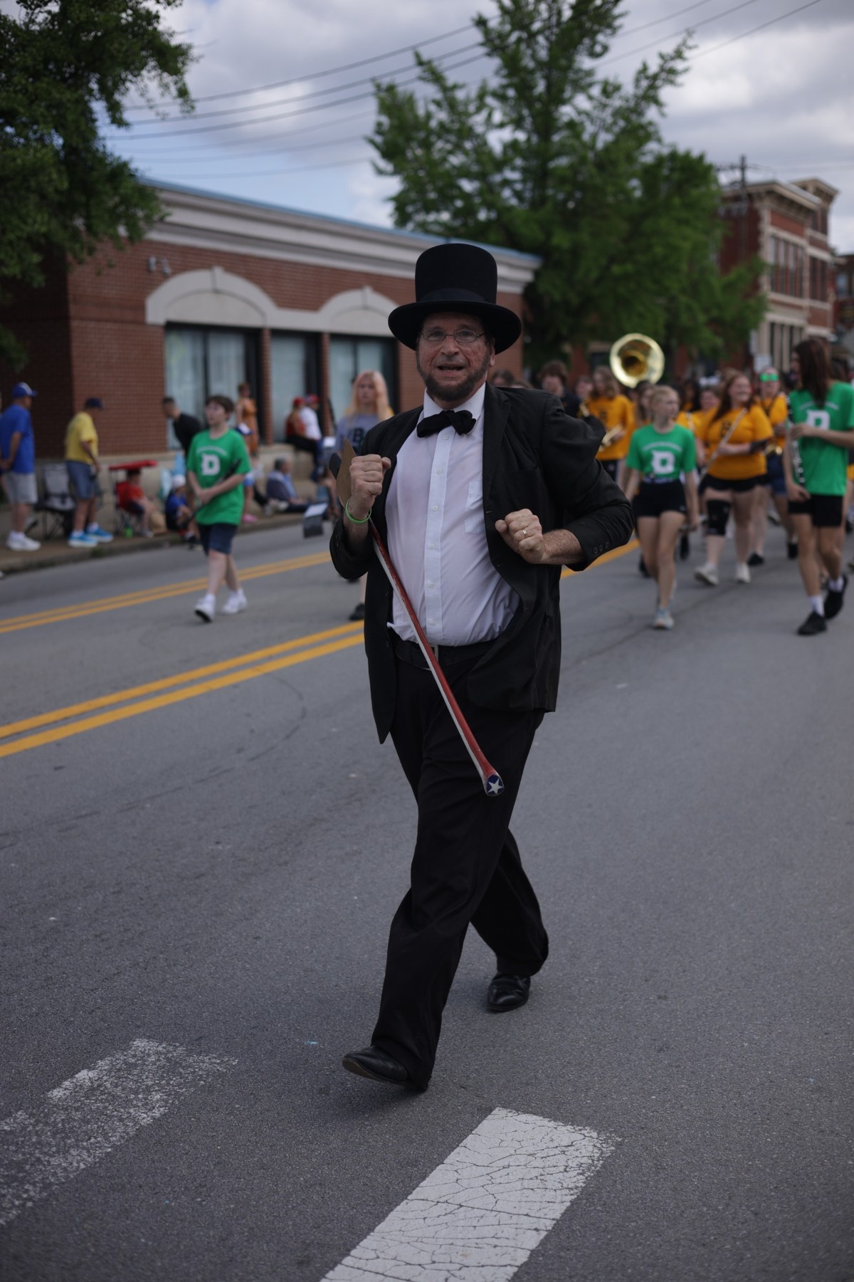 Costumed parade participant walking through a Northern Kentucky community event
