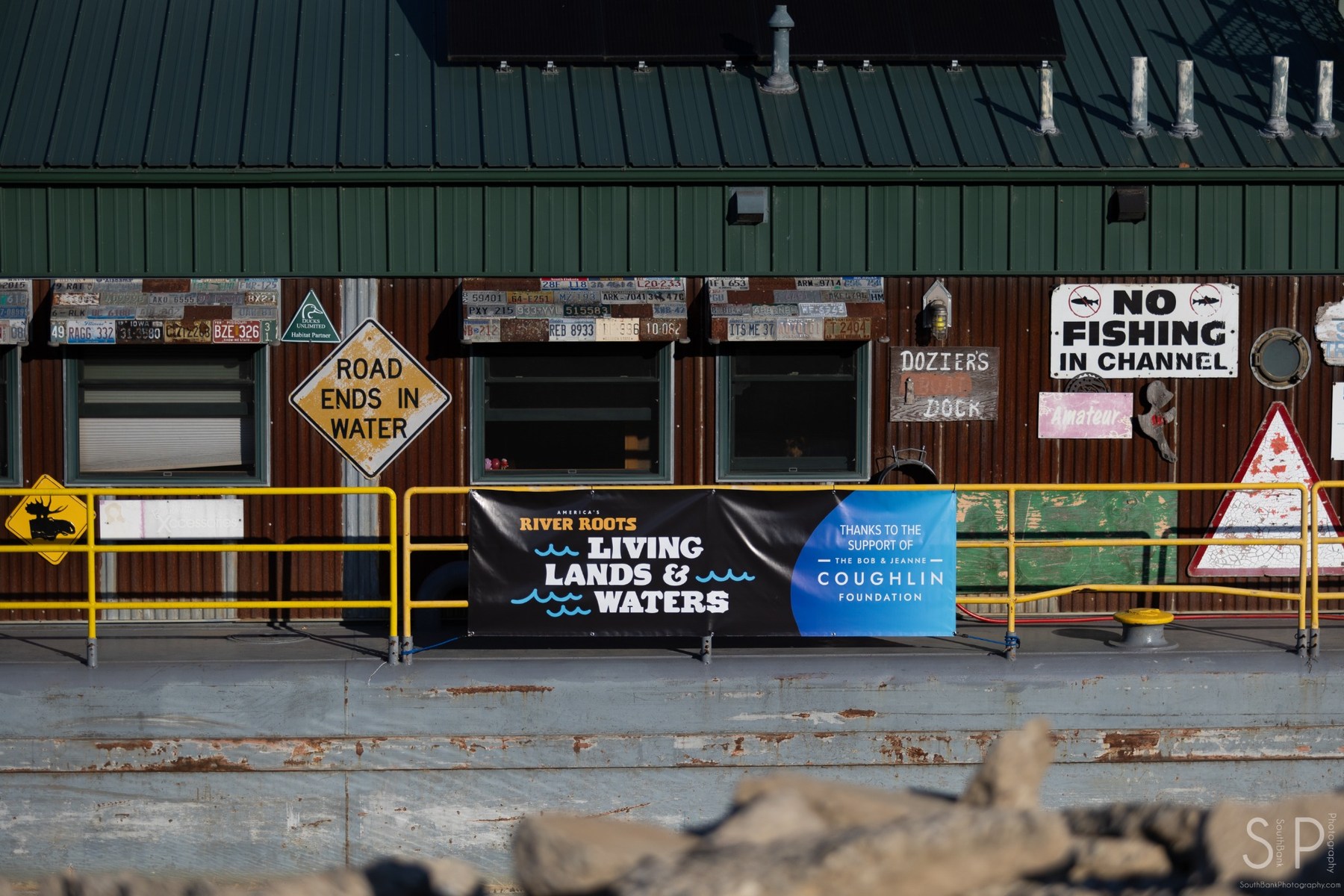 Riverfront dock exterior with vintage signs and industrial textures