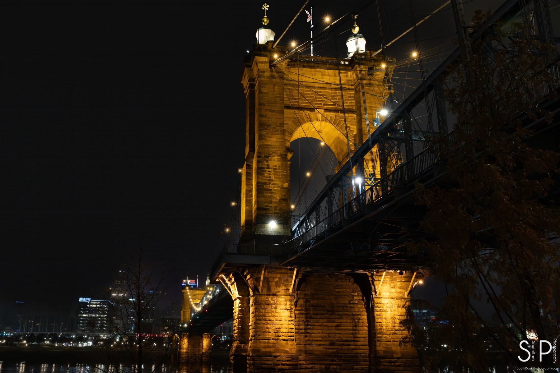 John A. Roebling Suspension Bridge illuminated at night in Cincinnati