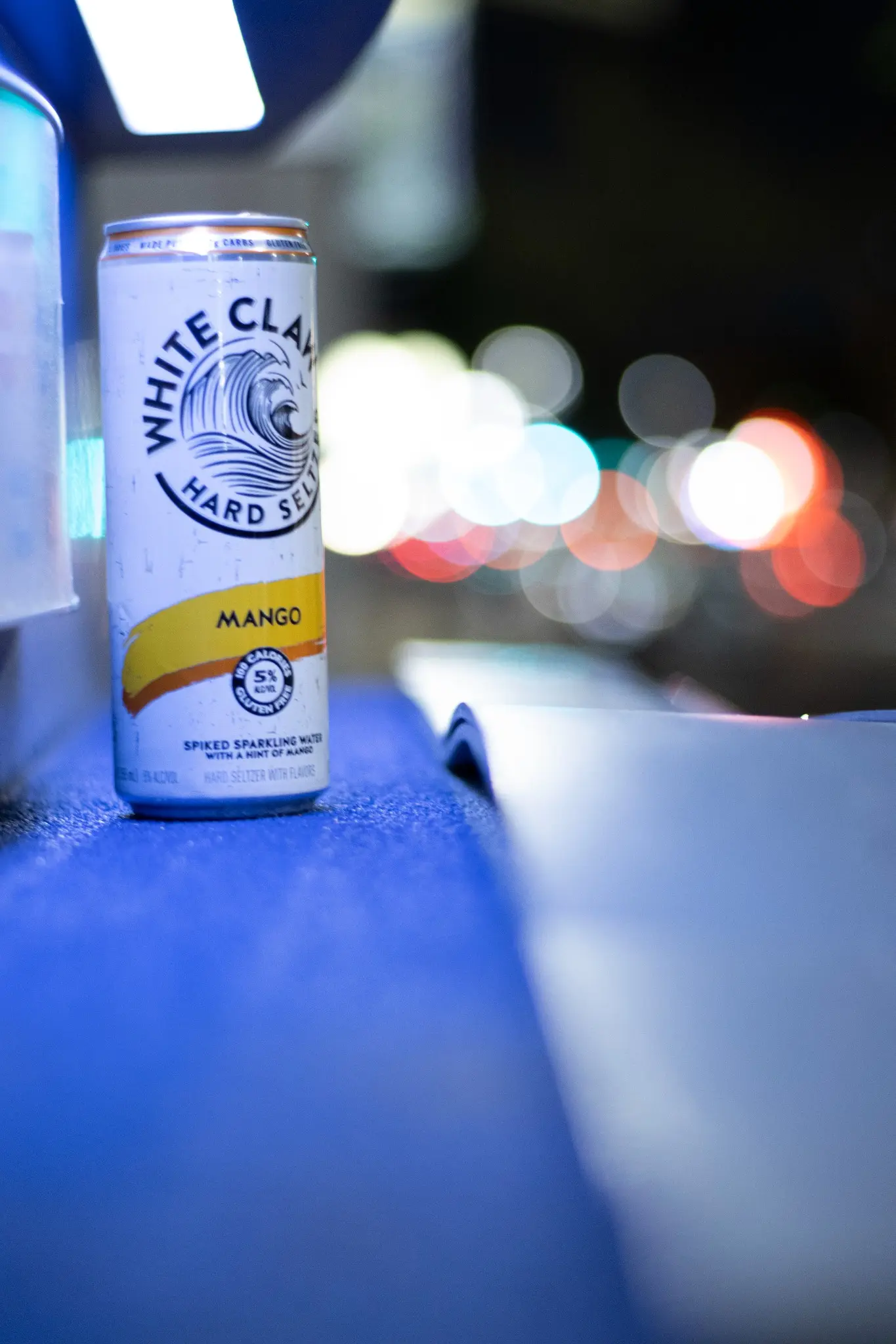 Street-side still life with colorful city bokeh